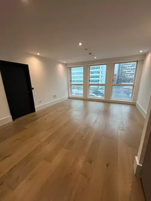 Newly installed wooden flooring in an empty modern apartment